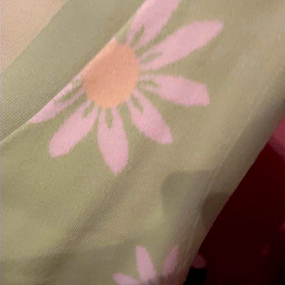 Green button vest with white sunflowers in a size Medium